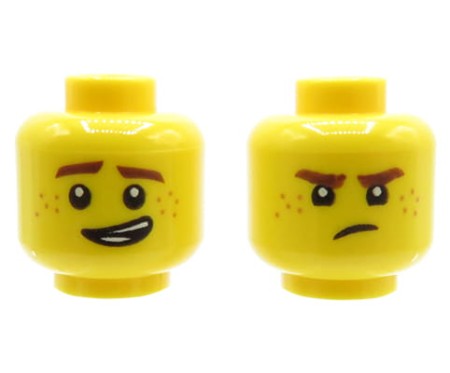 Głowa figurki LEGO w kolorze żółtym, dwustronna, męska, z piegami, przekrzywiony uśmiech/ grymas na twarzy