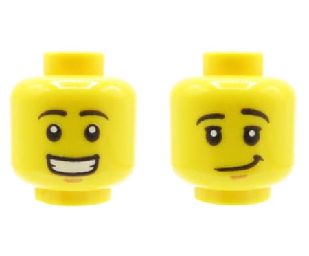 Głowa figurki LEGO w kolorze żółtym, dwustronna, męska, czarne brwi, szeroki uśmiech z zębami / uniesiona brew, przekrzywiony uśmiech.